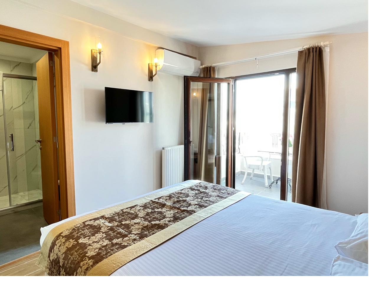 Balcony Sea View Room with balcony view and curtains