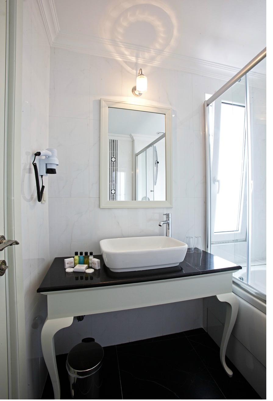 Superior Double Room bathroom with vanity and natural light