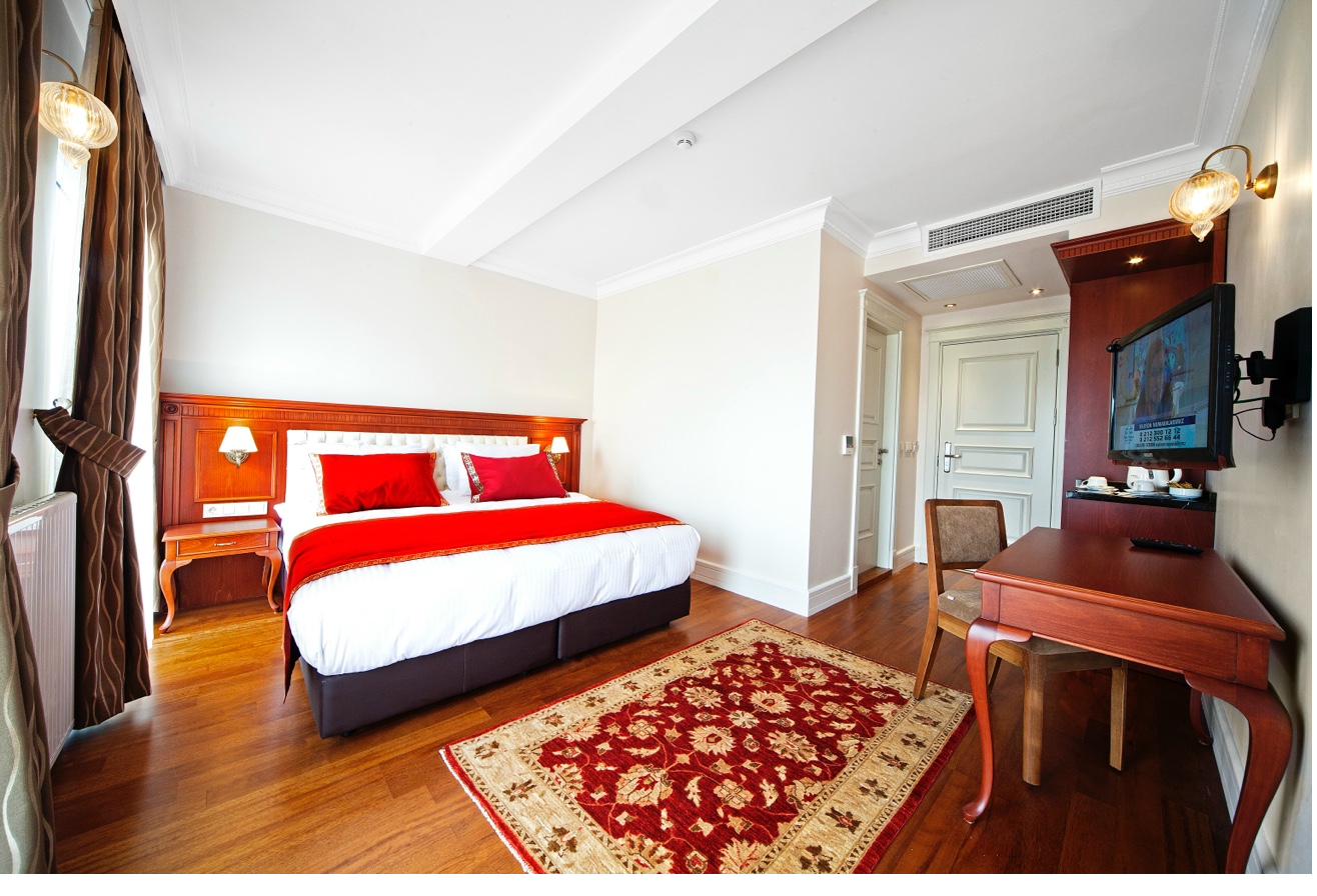 Superior Double Room wide view with carpet and furniture