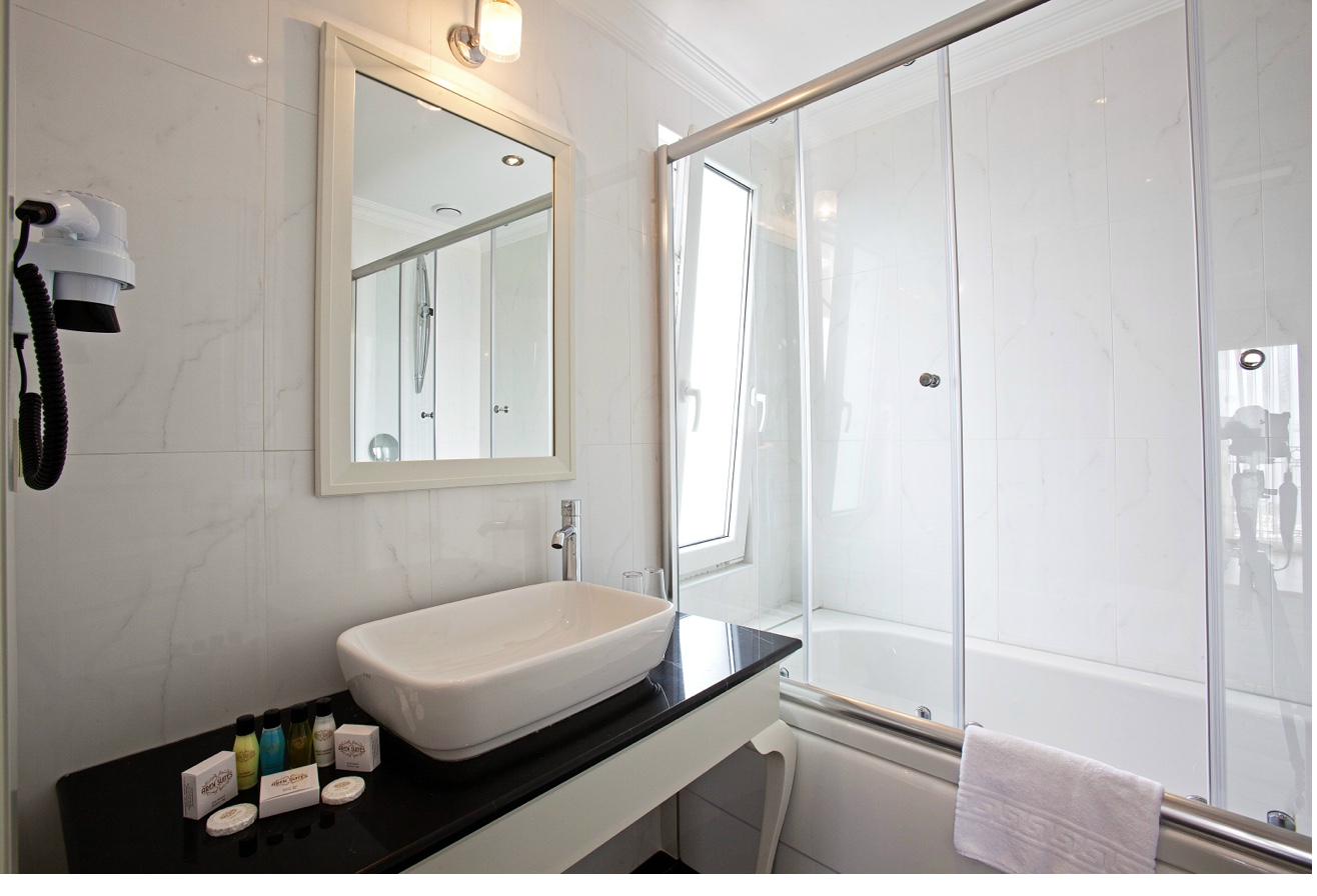 Superior Double Room bathroom with glass shower and vessel sink