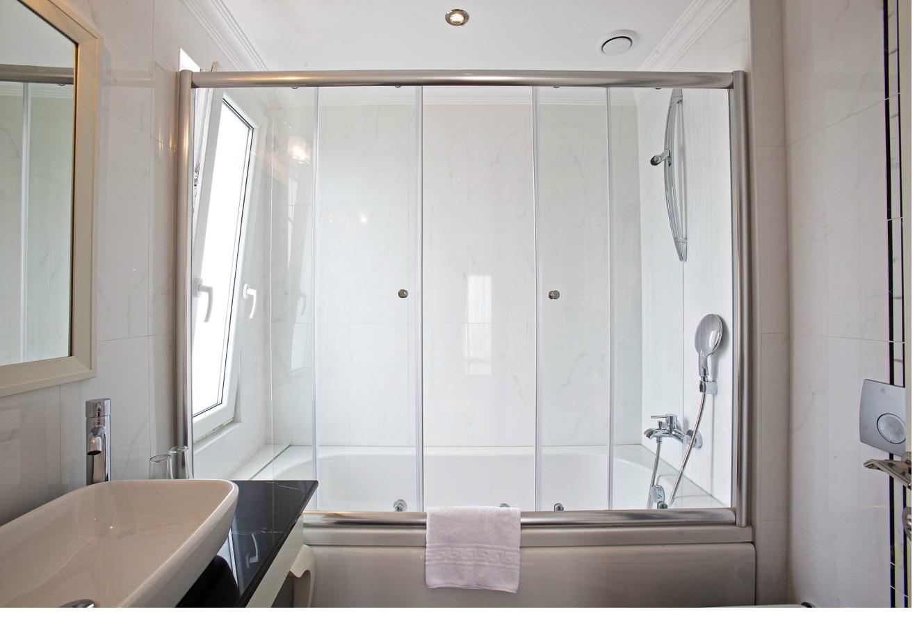 Superior Double Room bathroom vanity with mirror and amenities