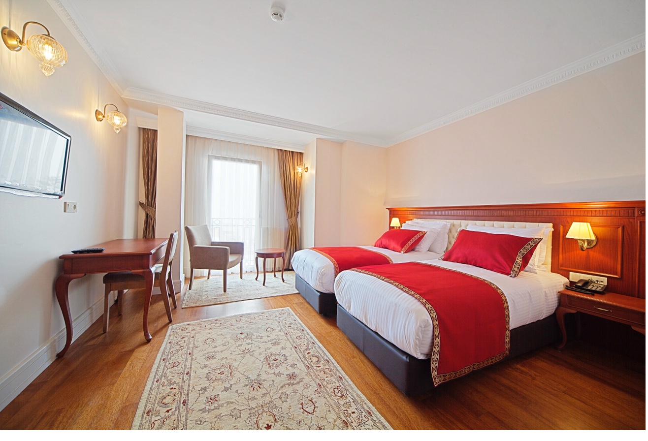 Superior Sea View Room bed detail with decorative pillows