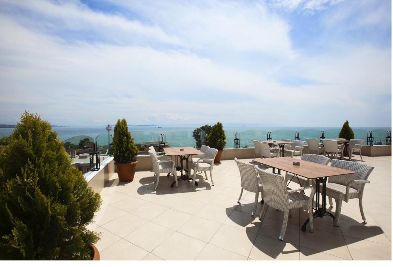 Spacious rooftop terrace with panoramic sea view and seating